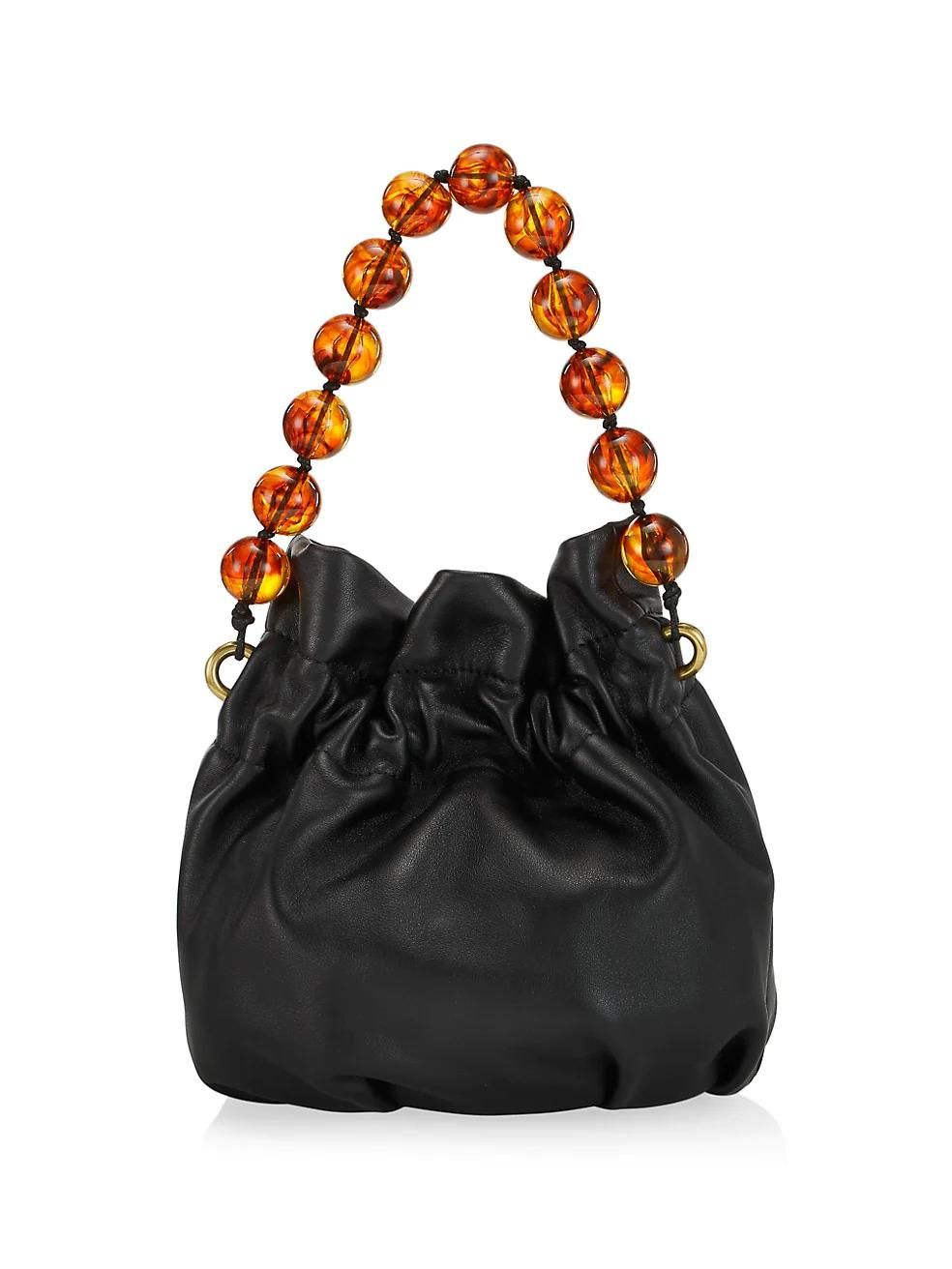 A magnetic closure makes sure the bag’s contents remain protected.